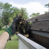 Cleaning Gutters Filled With Leaves & Sticks