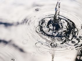 Rainwater harvesting in a large polymer tank on the terrace of a house. Ripples on the surface of water. Aquaphobia – fear of water.
