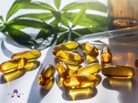 Medical cannabis products: leaf, capsules and CBD oil on white b