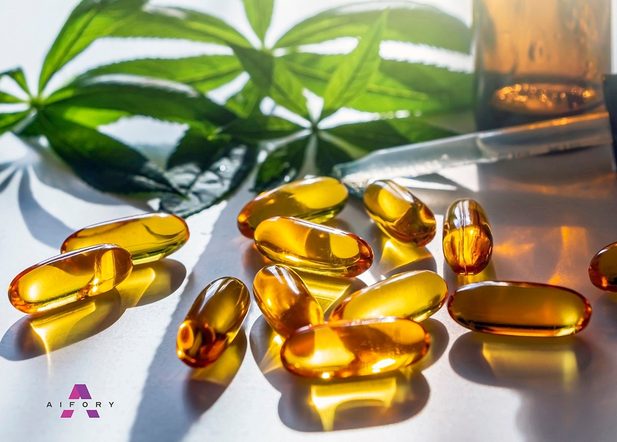 Medical cannabis products: leaf, capsules and CBD oil on white b