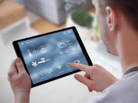 Smart home control on tablet. Interior of living room in the background.